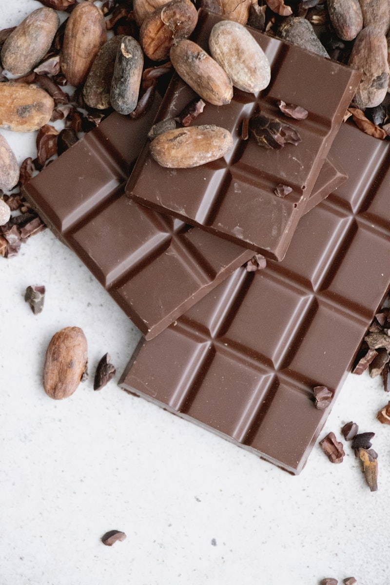 Assortment of handmade chocolate truffles on a rustic dark brown tray, elegant composition, macro shot